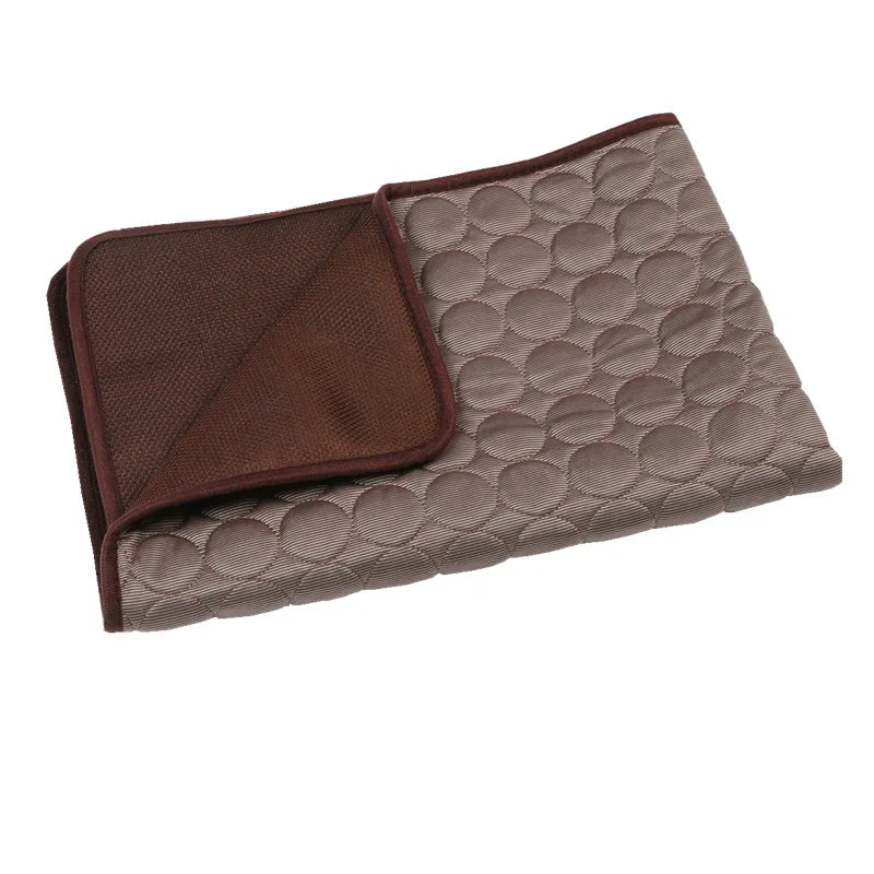 Folded Cooling Dog Mat & Pad with brown and beige patterns on a white background