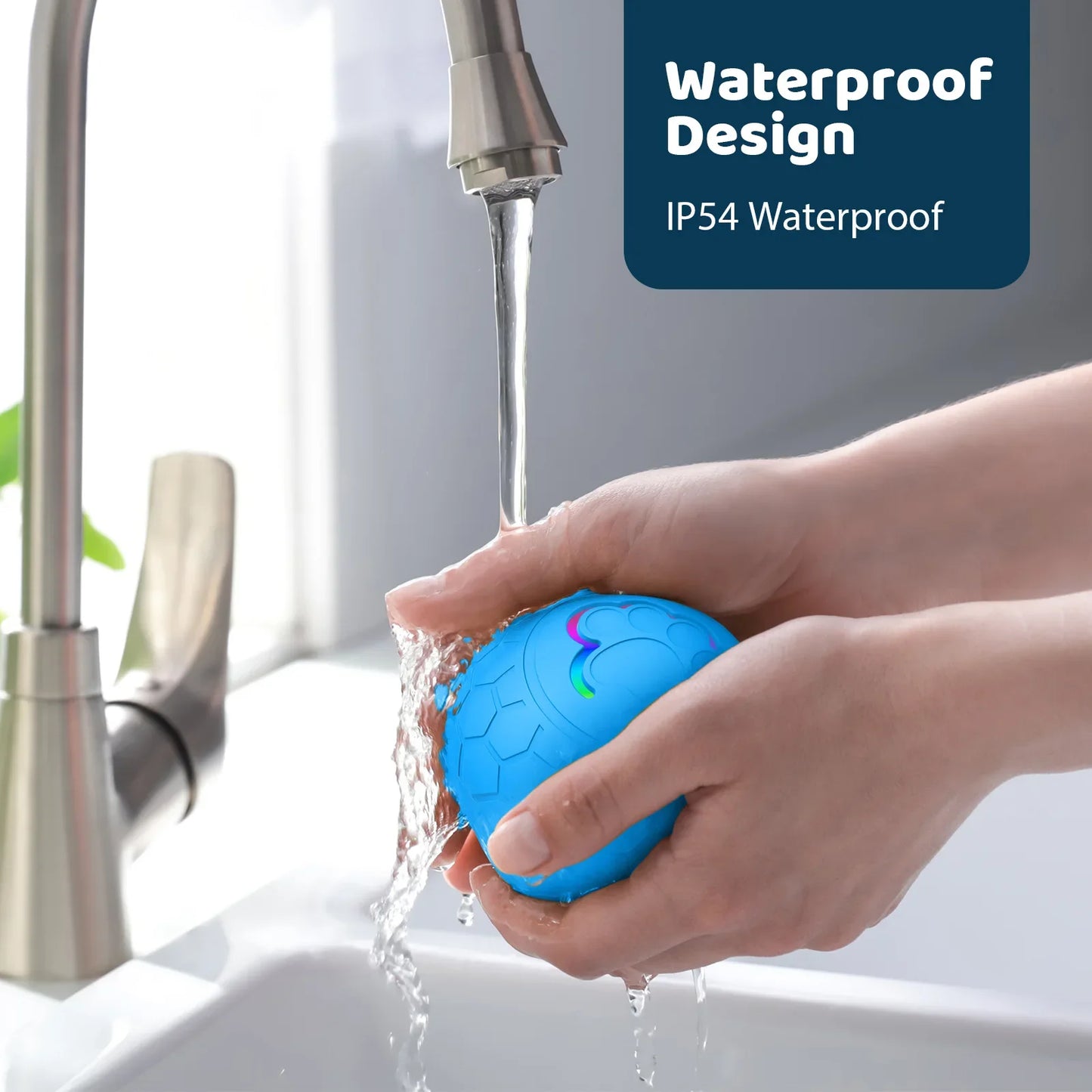 Blue ball with colorful design being rinsed under running water in a sink, labeled 'Waterproof Design IP54 Waterproof'.