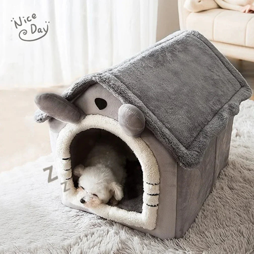 Pet house resembling a cartoon character with a small dog inside, on a soft surface.