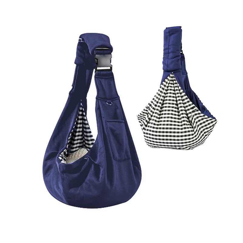 Navy blue pet sling with checkered interior on a white background