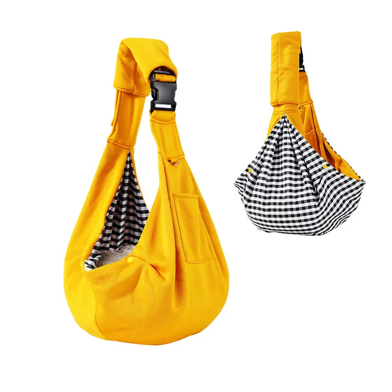 Yellow pet sling with checkered interior on a white background