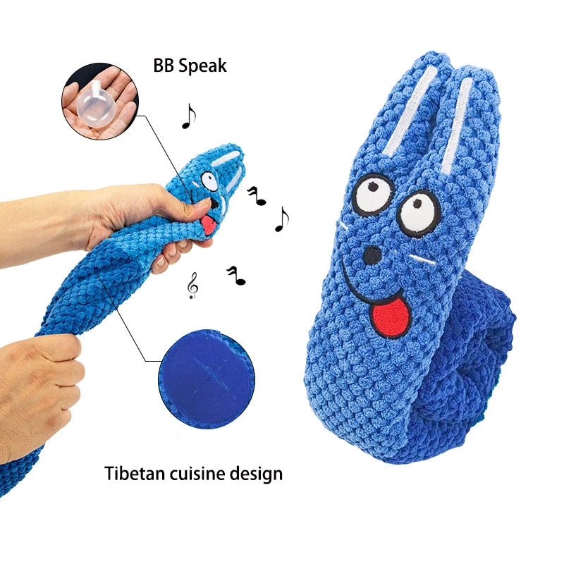 Blue toy with a face, labeled 'BB Speak' and 'Tibetan cuisine design', held by a hand.