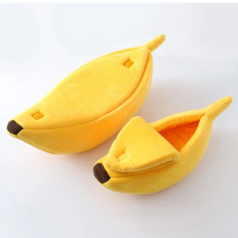 Two yellow banana-shaped slippers on a white background