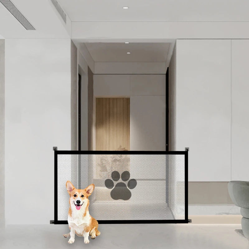 Dog standing next to a black pet gate with a paw print design in a modern home setting.
