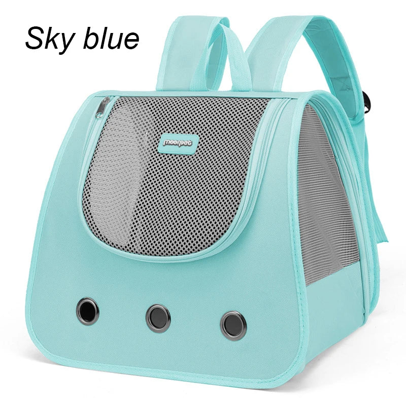 Light blue pet carrier with mesh sides on a white background