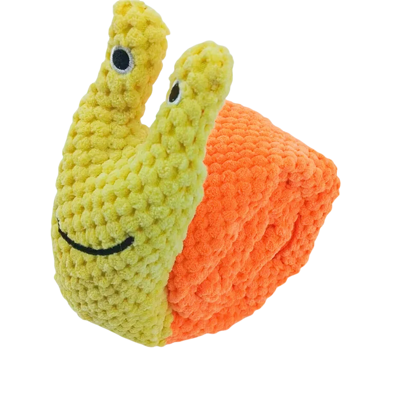 Plush toy snail with a smiling face on an orange shell against a white background