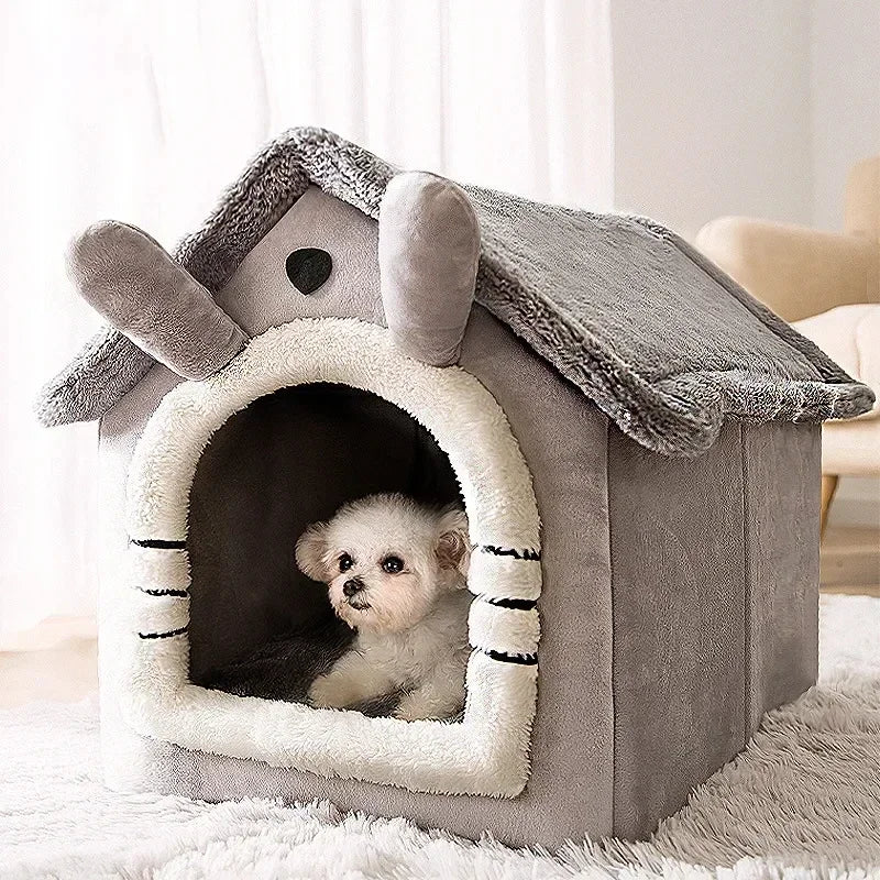 Dog peeking out from a gray pet house with a fluffy roof in a room.