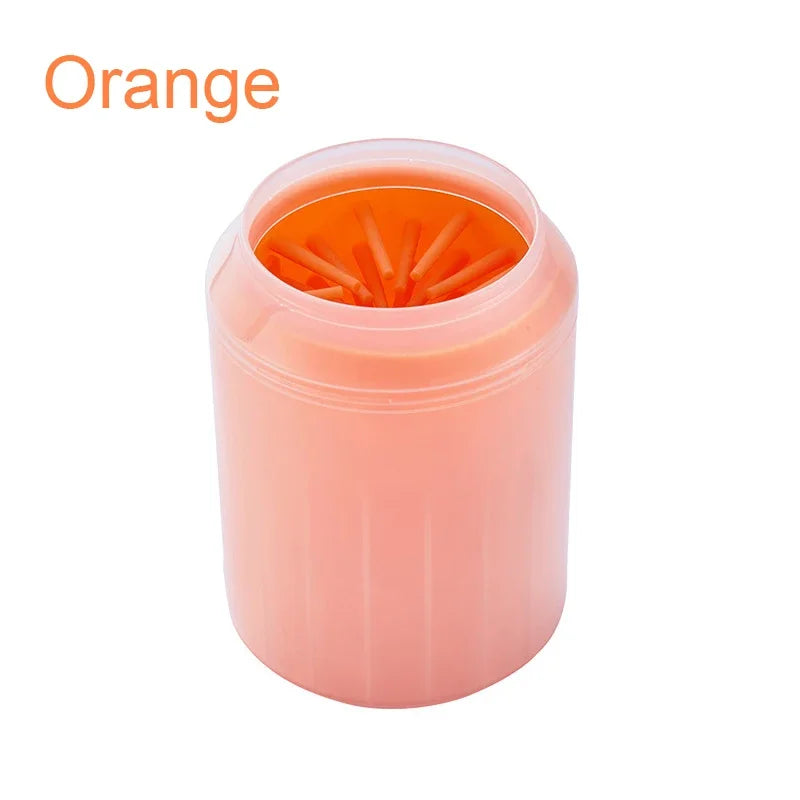 Orange soft silicone pet paw cleaner on a white background