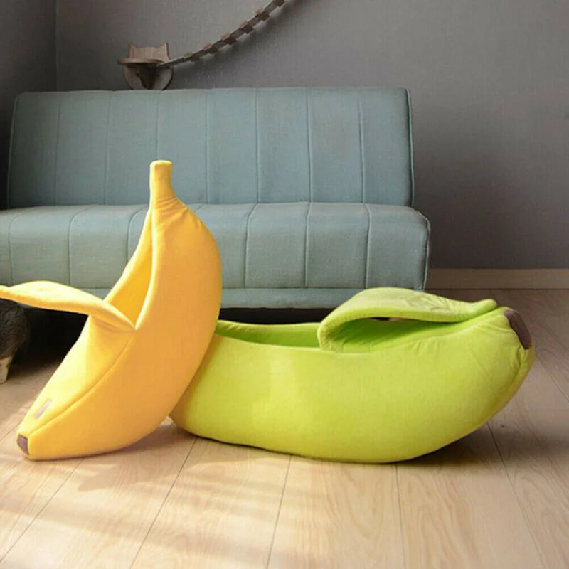 Two banana-shaped bean bags on a wooden floor with a gray couch in the background.