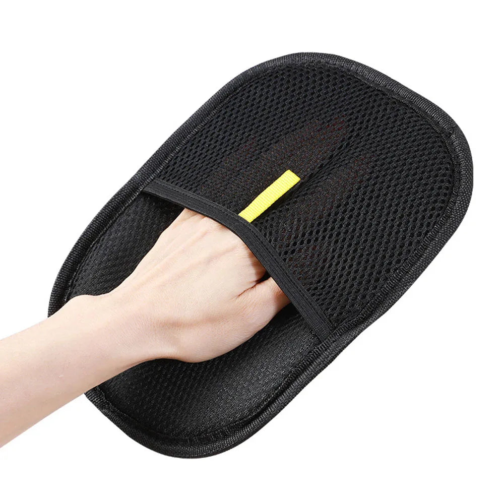Black Pet Grooming Gloves with a yellow tag on a white background
