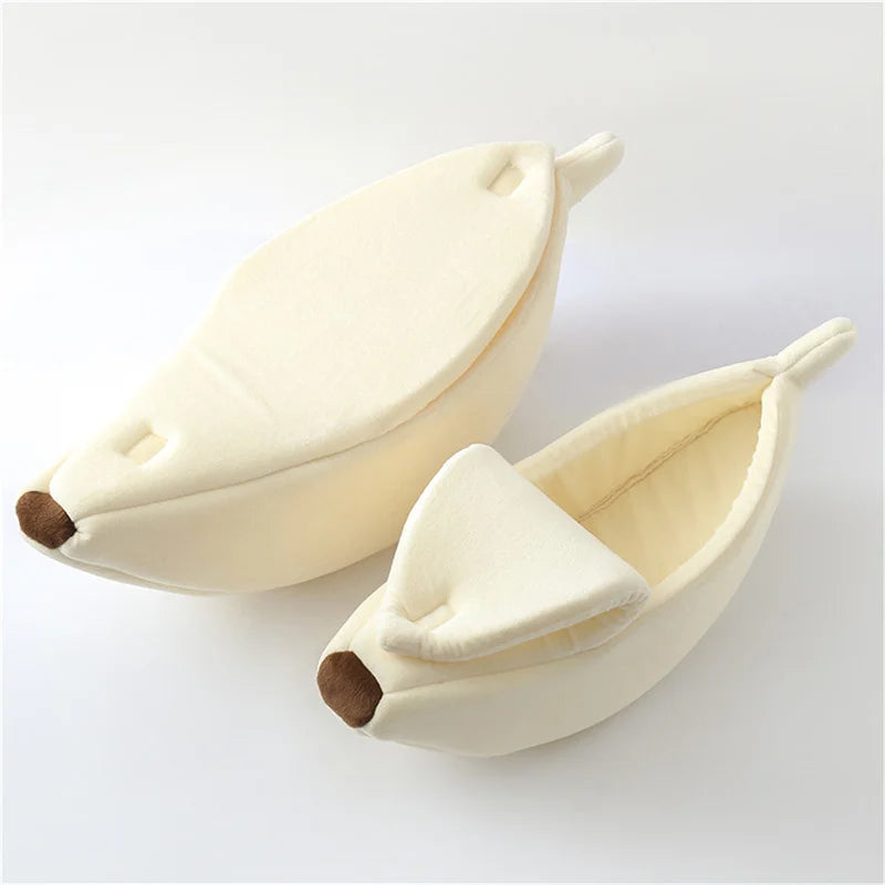 Pair of banana-shaped slippers on a white background