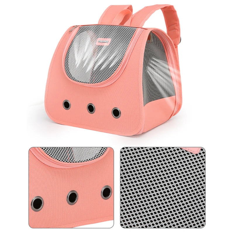 Pink pet carrier backpack with mesh sides on a white background