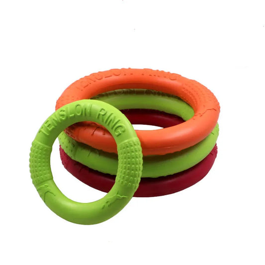 Stack of colorful EVA Dog Training Ring with 'Tensilon Ring' text on a white background