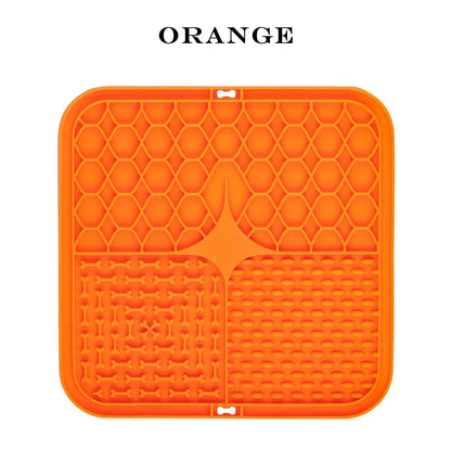 Orange silicone mat with textured surface on a white background