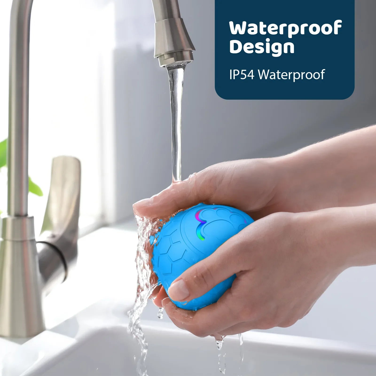 Blue ball with colorful design being rinsed under running water in a sink, labeled 'Waterproof Design IP54 Waterproof'.