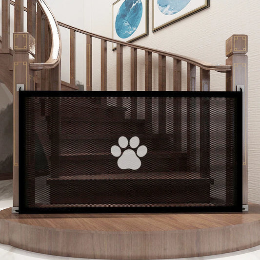 Black mesh pet gate with a paw design on a staircase