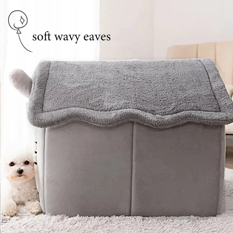 Gray pet bed with wavy eaves and a small white dog sitting next to it.