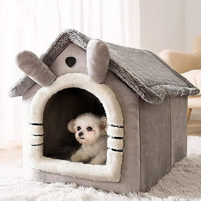 Dog peeking out from a gray pet house with a fluffy roof in a room.