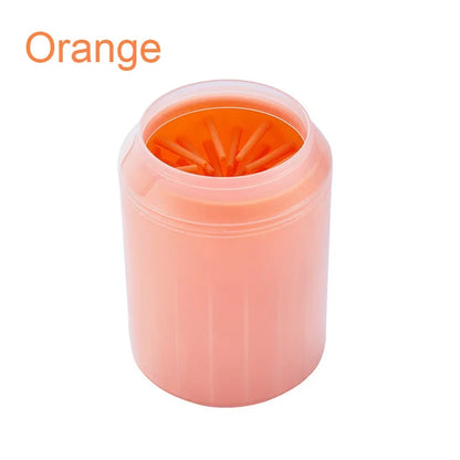 Orange soft silicone pet paw cleaner on a white background